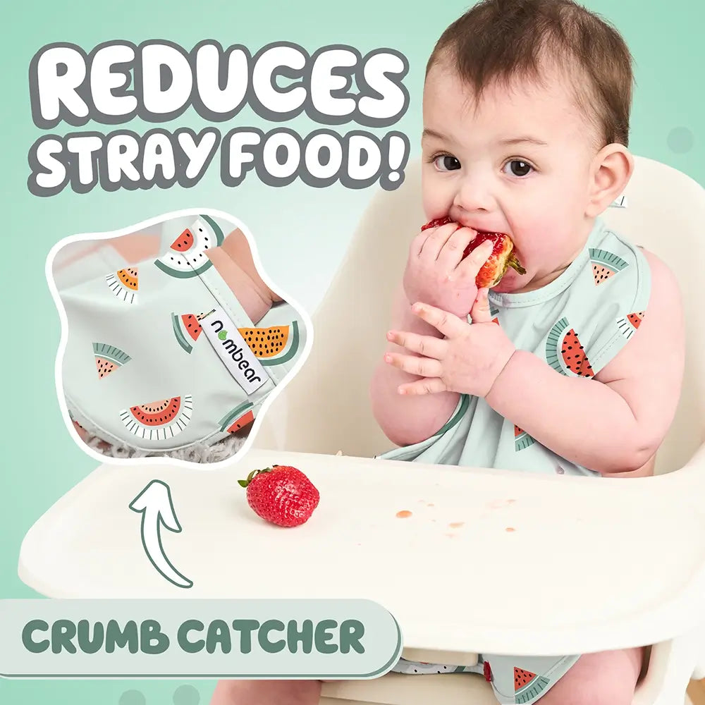 Baby Eating a Strawberry Wearing a Green Melon Bib. Reduces Stray Food! With Crumb Catcher.