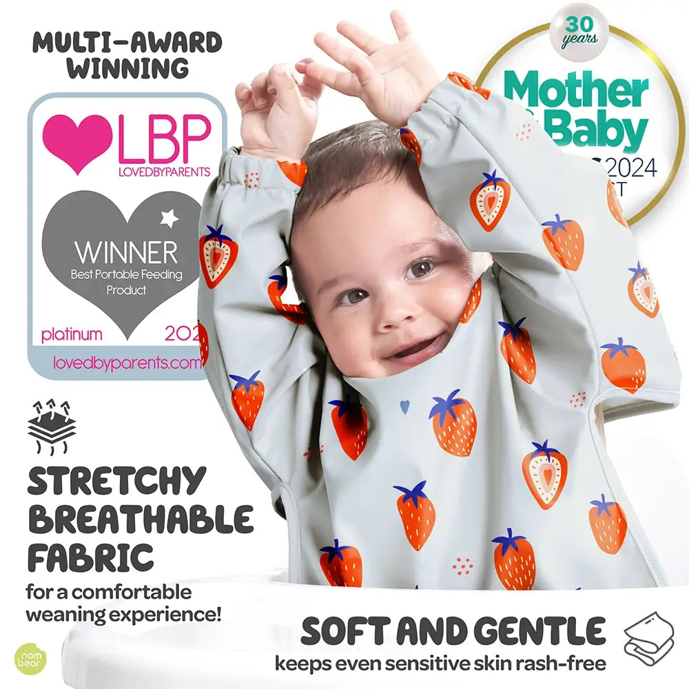 Baby Wearing a Strawberry-Patterned Bib Which is a LovedByParents and Mother & Baby Award Winner