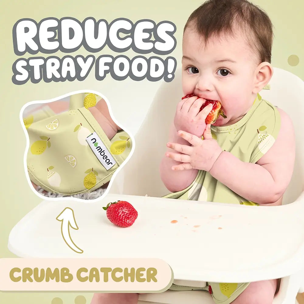 Baby Eating a Strawberry Wearing a Yellow Citrus Bib. Reduces Stray Food! With Crumb Catcher.