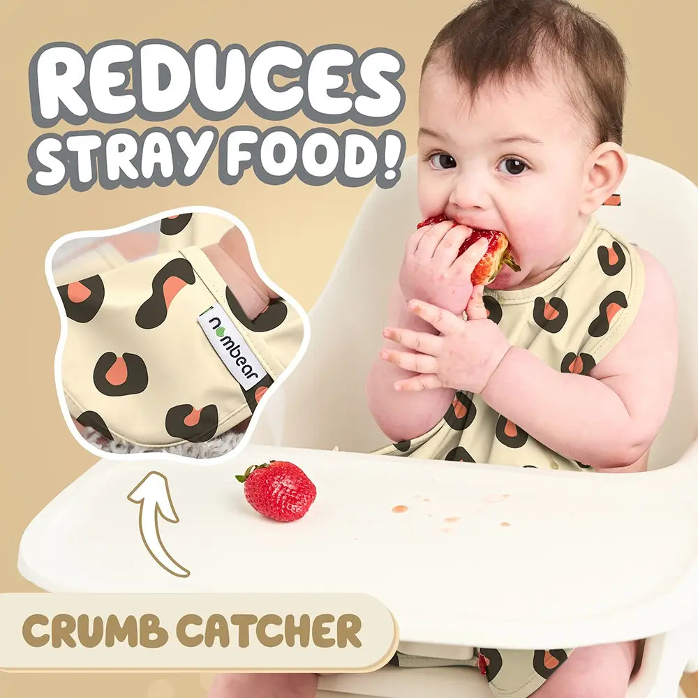 Baby Eating a Strawberry Wearing a Leopard Print Bib. Reduces Stray Food! With Crumb Catcher.