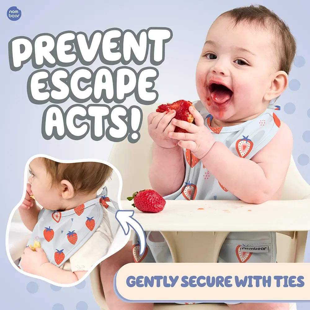 Baby Eating Messily, Wearing a Strawberry Blue Baby Bib. Prevent Escape Acts! Gently Secure with Ties.