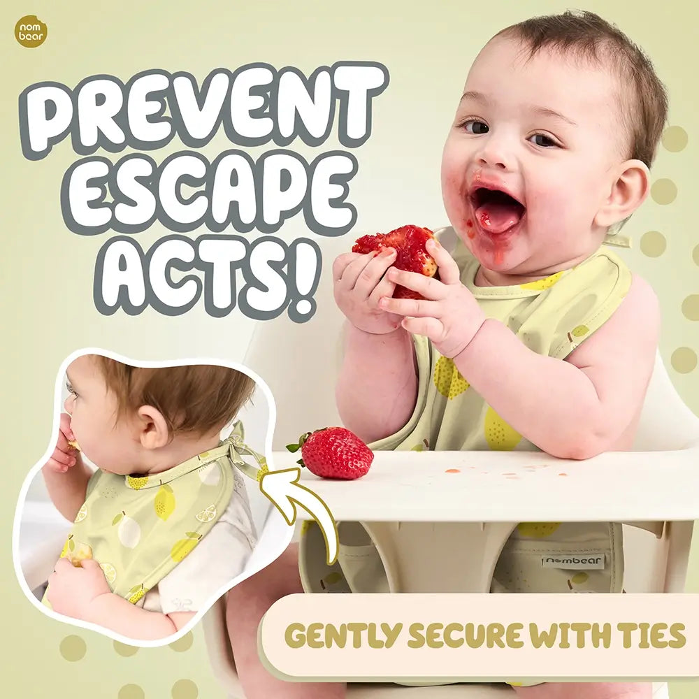 Baby Eating Messily, Wearing a Lemon Print Baby Bib. Prevent Escape Acts! Gently Secure with Ties.